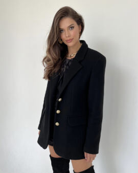 Black wool jacket with a versatile, feminine cut .