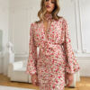 Dress made of delicate white viscose in a print of small roses. Lovin